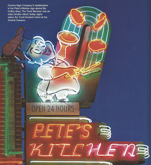 illuminated neon sign of a happy chef flipping pancakes at Pete's Kitchen