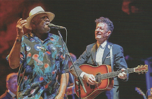 musicians Taj Mahal and Lyle Lovett playing on the eTown stage
